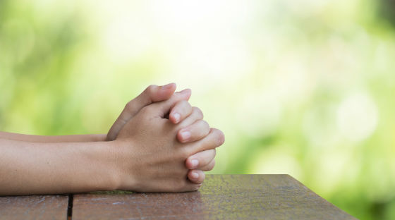 praying hands on bench